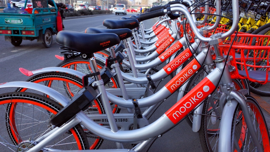 73310937 - beijing,china-february 2017-one row yellow bicycles called mobike shareing bicycle beside the street in beijing of china.