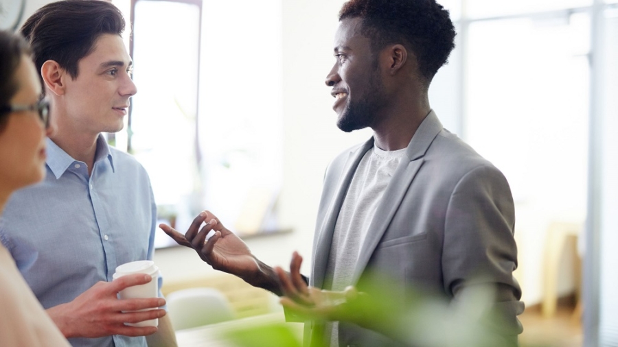 Group of employees having discussion in office